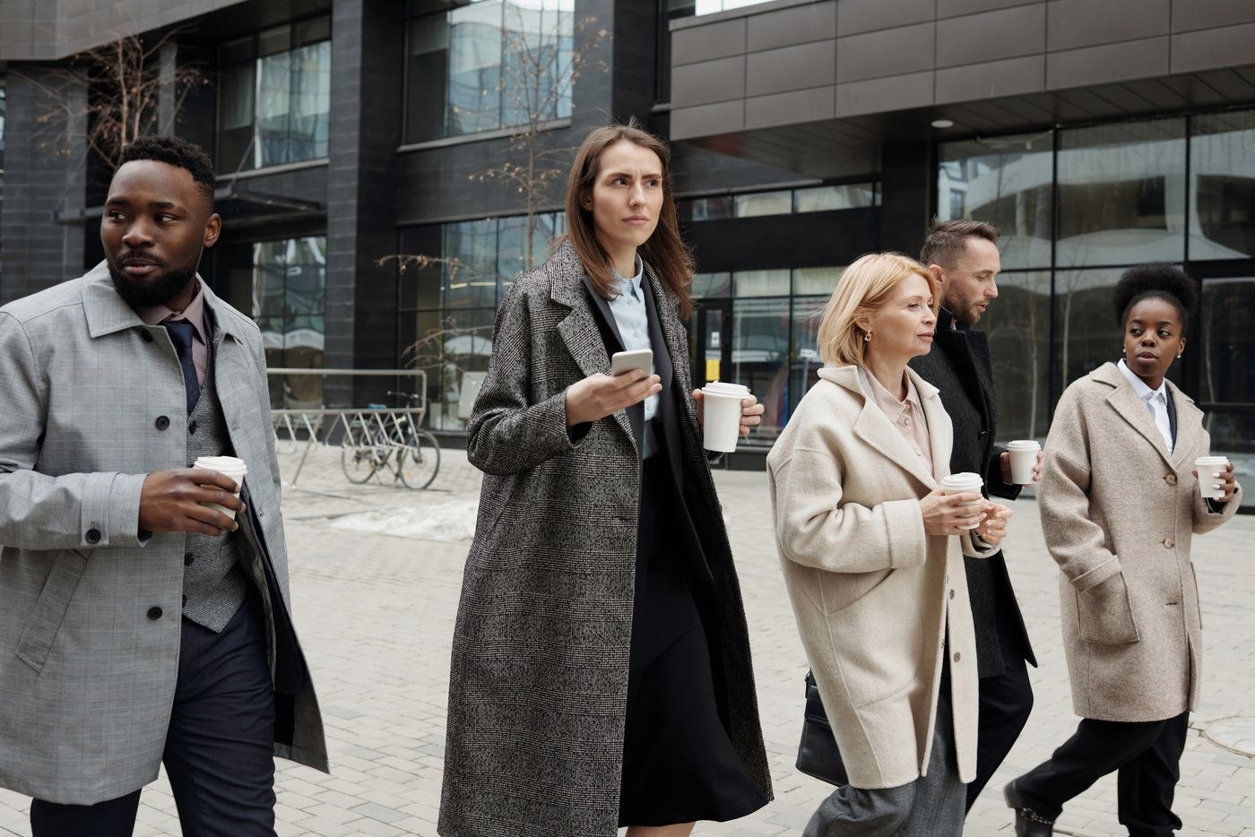 People taking a short outdoor walking break from work.
