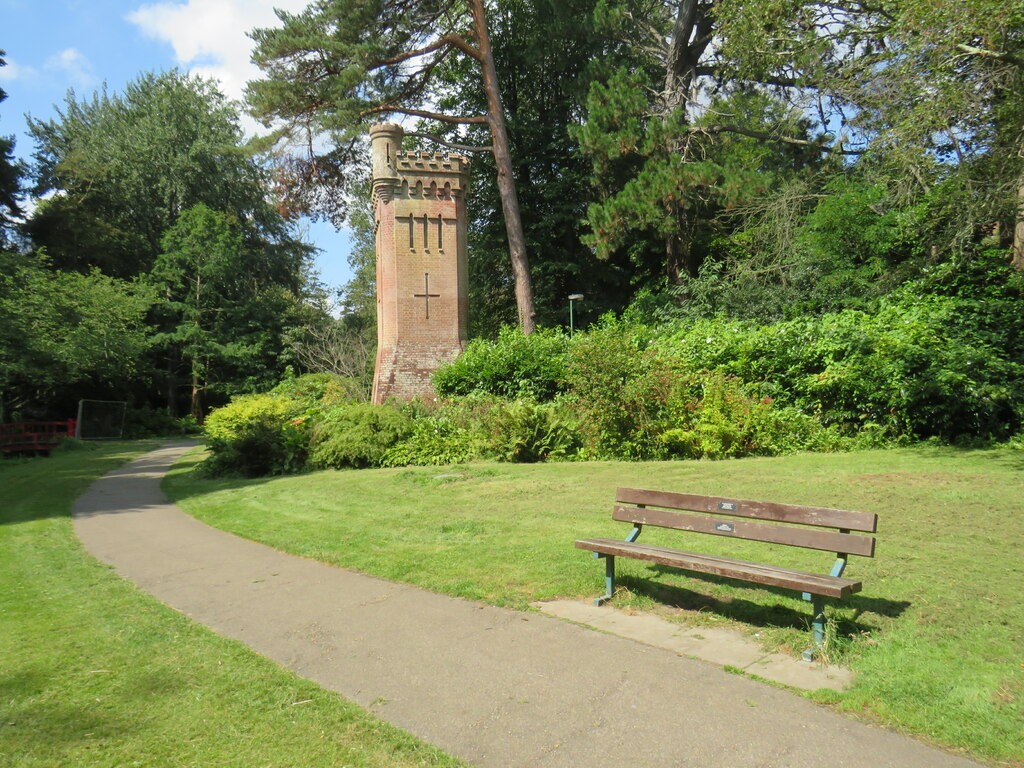 A path and bench beside the water tower in Bournemouth Upper Gardens.