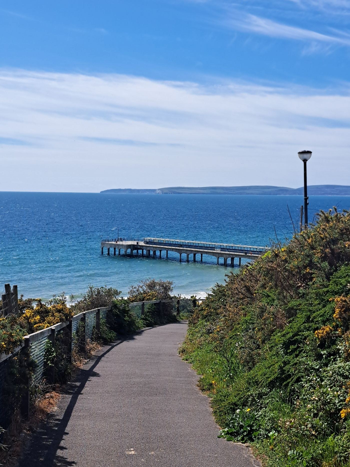A path descending towards Bournemouth seafront and pier.